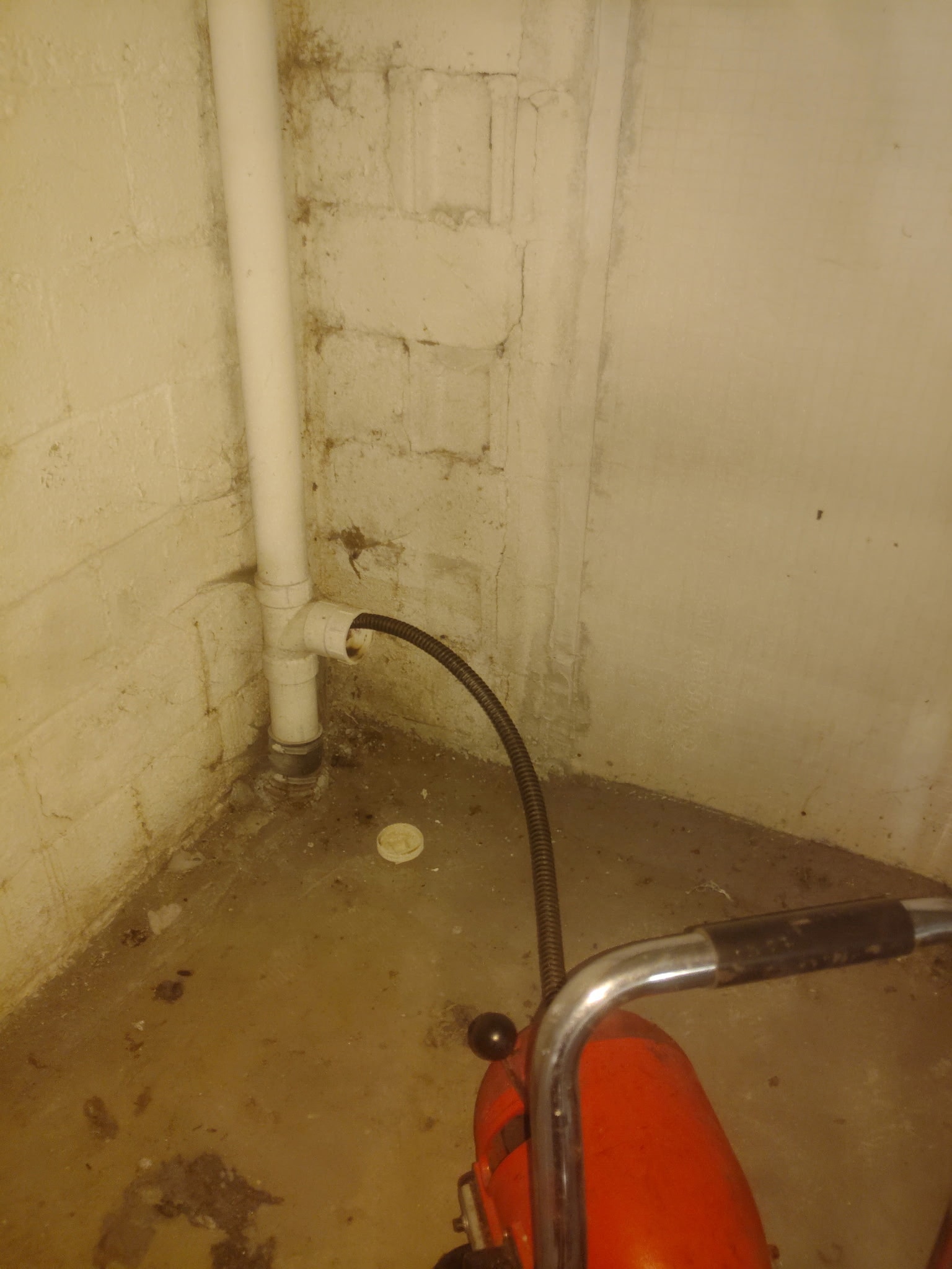 Plumber snaking a drain
